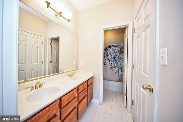 bathroom featuring tile patterned floors and double vanity