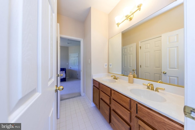 bathroom featuring tile patterned flooring and double vanity
