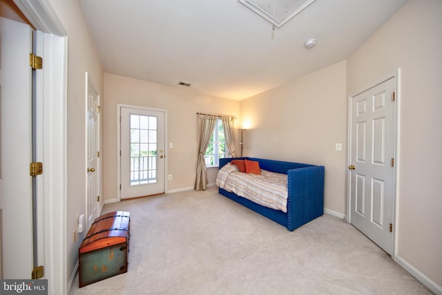 sitting room featuring carpet flooring, attic access, and baseboards
