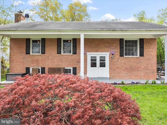 202 Glade Blvd, Walkersville, MD 21793 - bi-level home with a chimney, brick siding, and a front yard