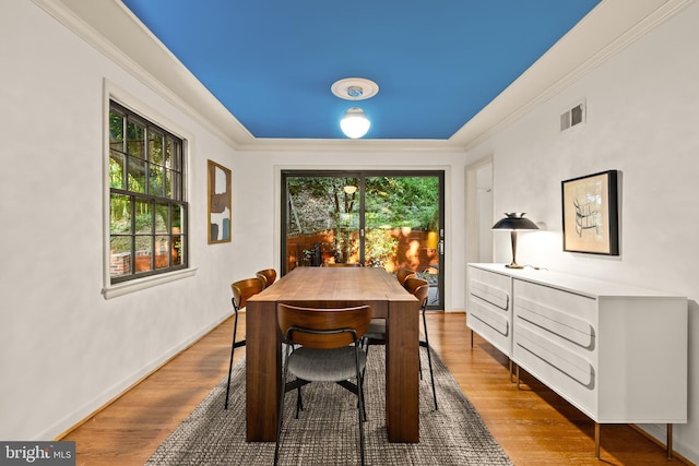 2646 S June St, Arlington, VA 22202 - dining space featuring wood finished floors, crown molding, and baseboards