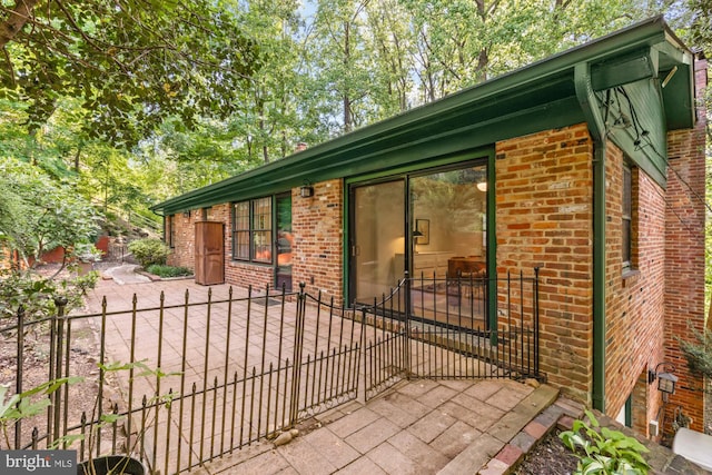 2646 S June St, Arlington, VA 22202 - view of side of property featuring brick siding and a gate