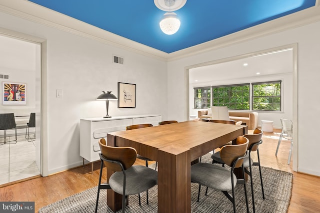 2646 S June St, Arlington, VA 22202 - dining area with crown molding, light wood-type flooring, and baseboards