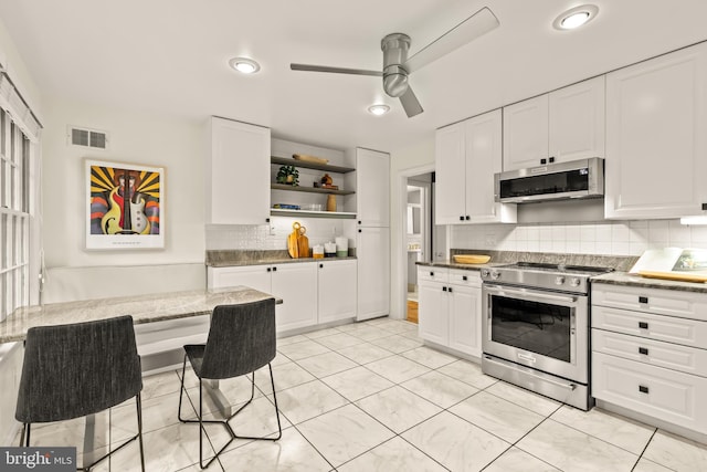 2646 S June St, Arlington, VA 22202 - kitchen featuring stainless steel appliances, open shelves, a ceiling fan, white cabinetry, and recessed lighting