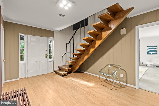 2646 S June St, Arlington, VA 22202 - entrance foyer featuring crown molding, wood finished floors, stairs, and baseboards