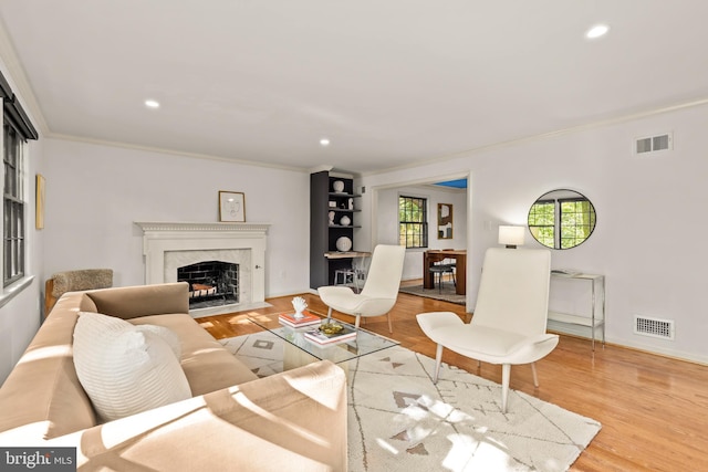 2646 S June St, Arlington, VA 22202 - living area featuring ornamental molding, a fireplace, wood finished floors, recessed lighting, and baseboards