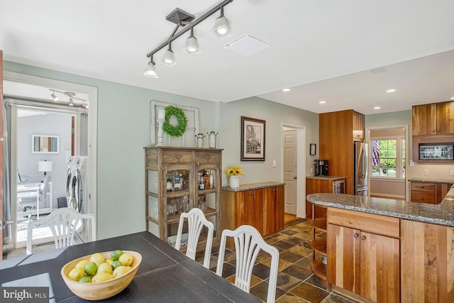 2801 Riva Rd, Annapolis, MD 21401 - dining area with track lighting, washing machine and clothes dryer, and recessed lighting