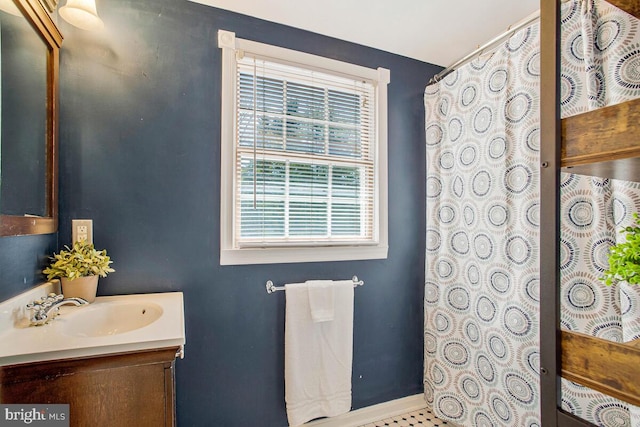 2801 Riva Rd, Annapolis, MD 21401 - full bath featuring baseboards, vanity, and a shower with shower curtain