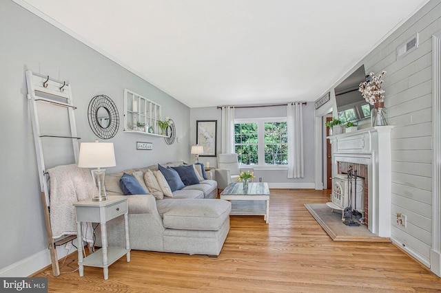 2801 Riva Rd, Annapolis, MD 21401 - living area featuring visible vents, baseboards, light wood-style floors, and ornamental molding