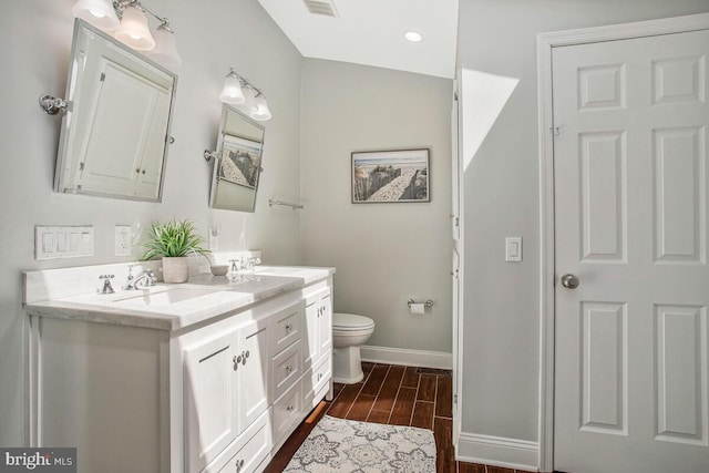2801 Riva Rd, Annapolis, MD 21401 - full bathroom featuring a sink, double vanity, toilet, baseboards, and wood finished floors