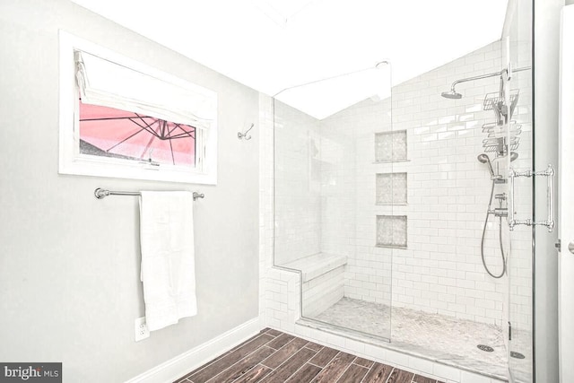 2801 Riva Rd, Annapolis, MD 21401 - full bath featuring baseboards, vaulted ceiling, wood tiled floor, and a stall shower