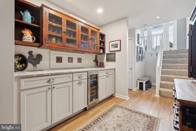 15 Chesapeake Lndg, Annapolis, MD 21403 - bar featuring light wood-style floors, wine cooler, stairs, baseboards, and recessed lighting