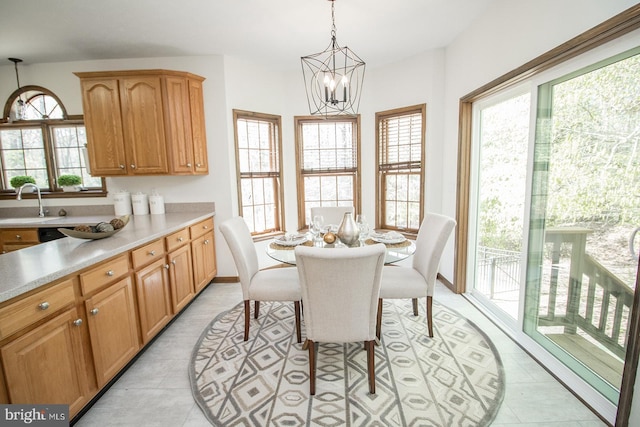 dining space with a chandelier and baseboards