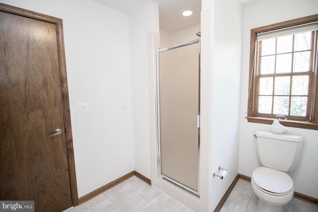 bathroom with baseboards, tile patterned floors, recessed lighting, toilet, and a shower stall