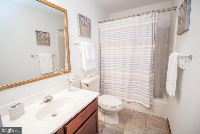 bathroom with tile patterned flooring, shower / bath combo with shower curtain, vanity, and toilet