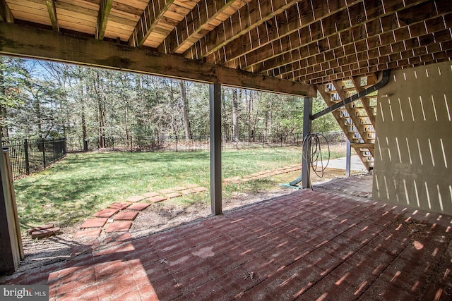 deck with a fenced backyard and a lawn