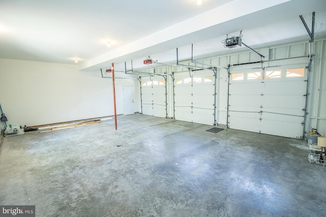 garage featuring a garage door opener