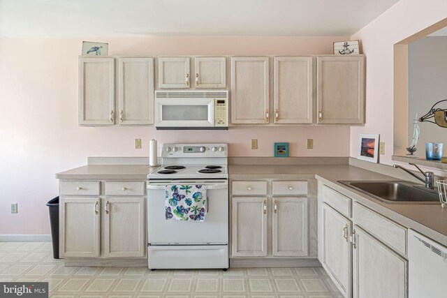 30381 Crowley Dr Unit 309, Ocean View, DE 19970 - kitchen with white appliances, light countertops, light floors, and a sink