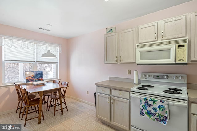 30381 Crowley Dr Unit 309, Ocean View, DE 19970 - kitchen featuring baseboards, visible vents, light floors, and white appliances
