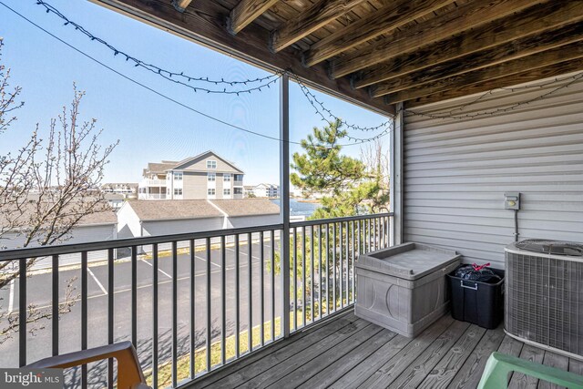 30381 Crowley Dr Unit 309, Ocean View, DE 19970 - wooden terrace with central AC unit and a residential view