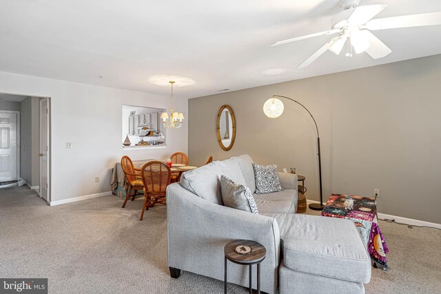 30381 Crowley Dr Unit 309, Ocean View, DE 19970 - living room with baseboards, ceiling fan with notable chandelier, and carpet