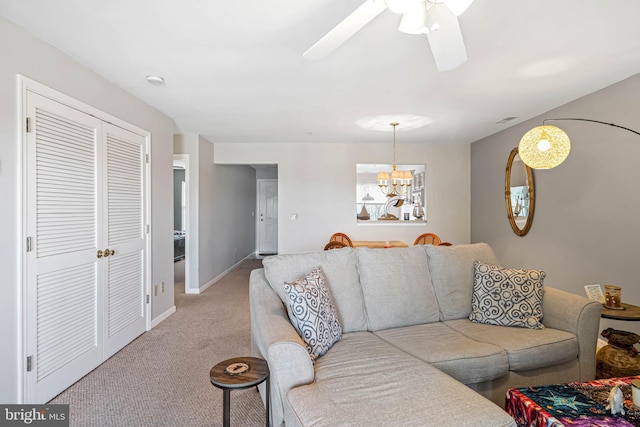 30381 Crowley Dr Unit 309, Ocean View, DE 19970 - living area with ceiling fan with notable chandelier, baseboards, and light colored carpet