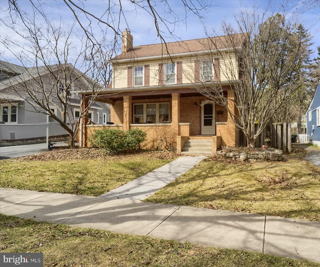 157 Hartswick Ave, State College, PA 16803 - view of front of home featuring brick siding and a chimney