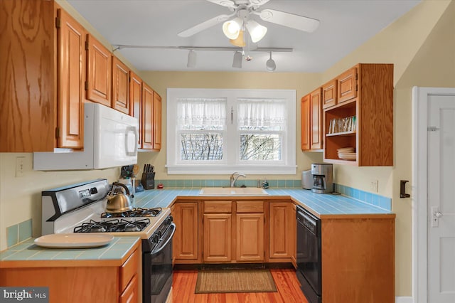 157 Hartswick Ave, State College, PA 16803 - kitchen with a sink, dishwasher, range with gas cooktop, and tile counters