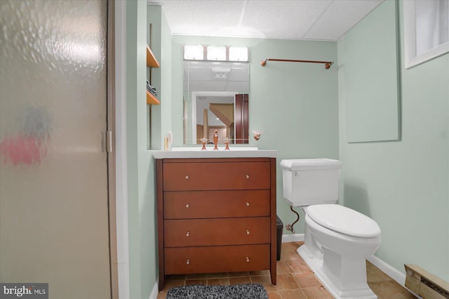 157 Hartswick Ave, State College, PA 16803 - bathroom with vanity, baseboards, a baseboard radiator, tile patterned floors, and toilet