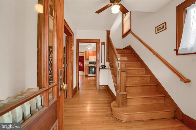 157 Hartswick Ave, State College, PA 16803 - staircase featuring baseboards, wood finished floors, and ceiling fan