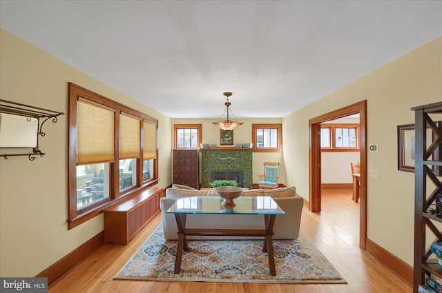 157 Hartswick Ave, State College, PA 16803 - dining area featuring a fireplace, baseboards, and light wood finished floors