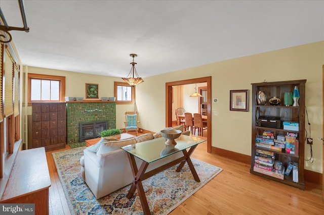 157 Hartswick Ave, State College, PA 16803 - living room with baseboards, light wood-style floors, and a fireplace
