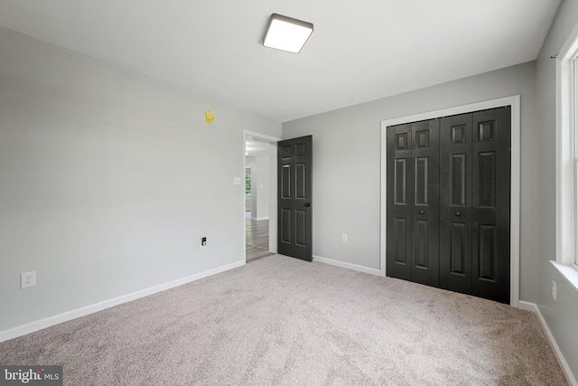 246 Locust Ln, Edinburg, VA 22824 - unfurnished bedroom with baseboards, a closet, and carpet floors