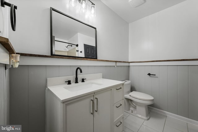 246 Locust Ln, Edinburg, VA 22824 - bathroom with walk in shower, toilet, a decorative wall, a wainscoted wall, and vanity