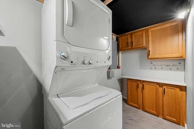 246 Locust Ln, Edinburg, VA 22824 - washroom with stacked washing maching and dryer and cabinet space