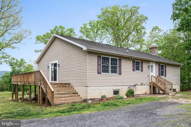 246 Locust Ln, Edinburg, VA 22824 - view of front of property featuring stairway, a deck, and a chimney