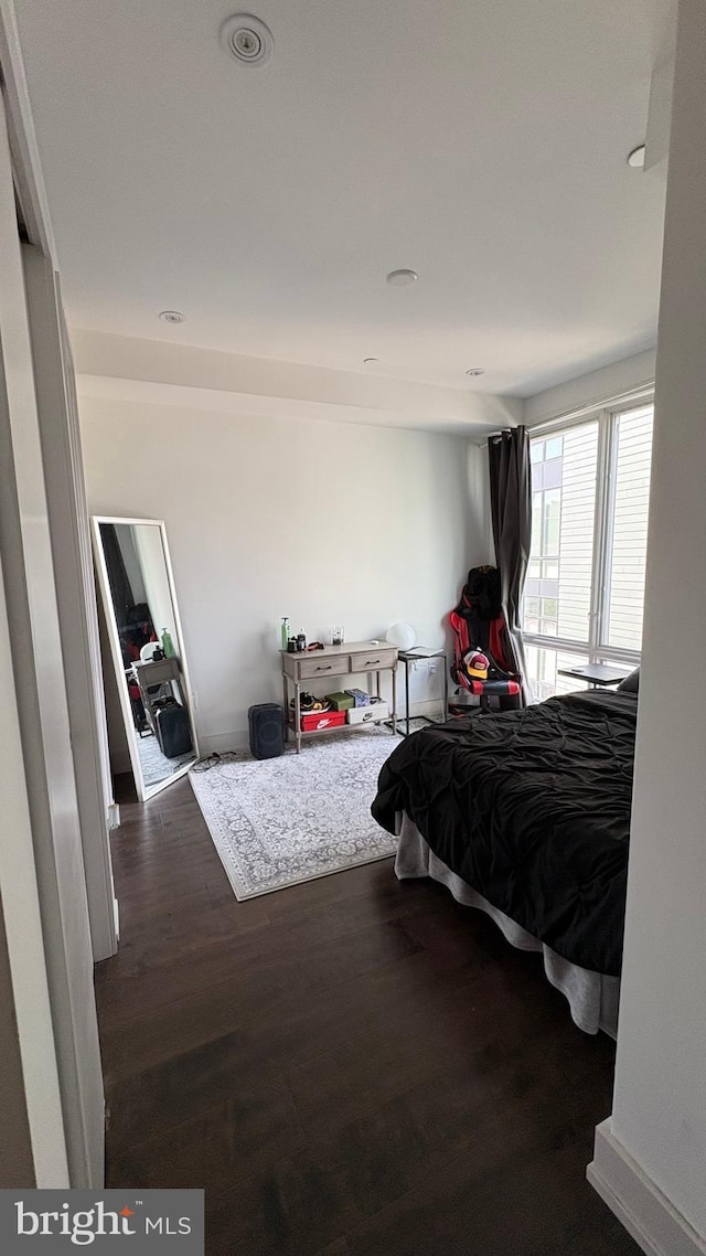 bedroom featuring recessed lighting and wood finished floors