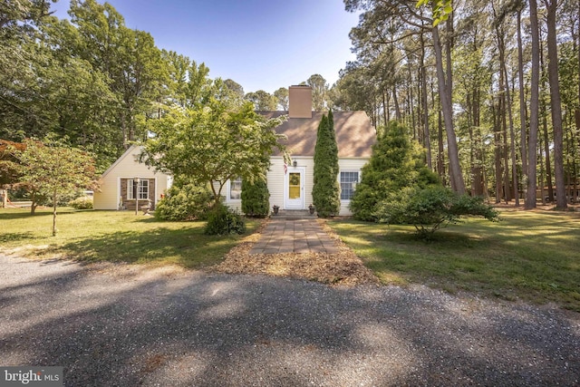 26547 Old State Rd, Crisfield, MD 21817 - cape cod home featuring a front yard and a chimney