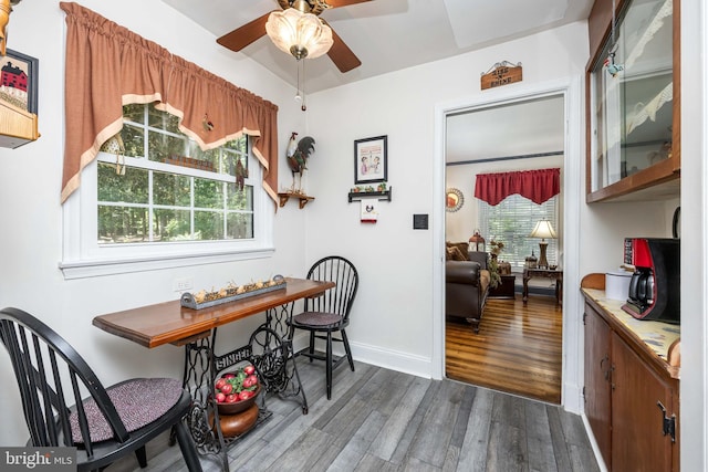 26547 Old State Rd, Crisfield, MD 21817 - dining room with a ceiling fan, dark wood-style flooring, and baseboards