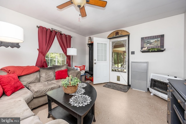 26547 Old State Rd, Crisfield, MD 21817 - living area featuring heating unit, ceiling fan, dark aggregate flooring, and lofted ceiling