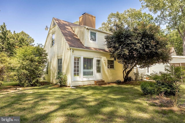 26547 Old State Rd, Crisfield, MD 21817 - back of property featuring entry steps, a lawn, a chimney, and a shingled roof