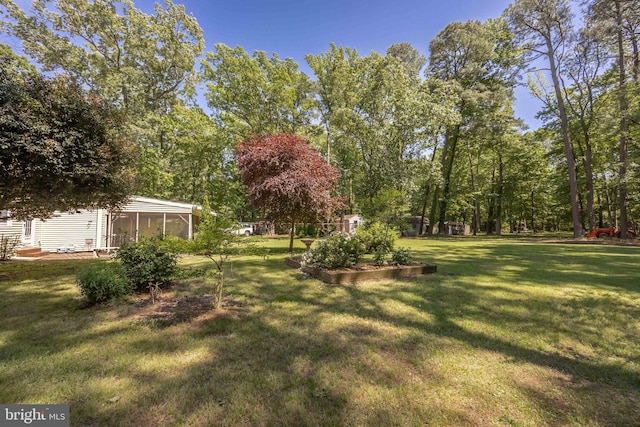 26547 Old State Rd, Crisfield, MD 21817 - view of green lawn with a sunroom