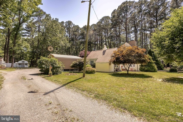 26547 Old State Rd, Crisfield, MD 21817 - view of front of home featuring a front yard, dirt driveway, and view of scattered trees