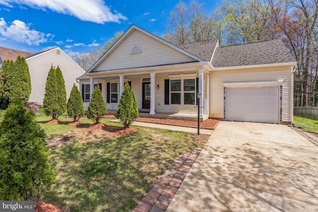 2540 Merganser Ct, Waldorf, MD 20601 - view of front of house with driveway, an attached garage, a porch, and a front yard