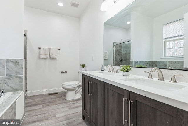 2540 Merganser Ct, Waldorf, MD 20601 - bathroom with toilet, a sink, a shower stall, and visible vents