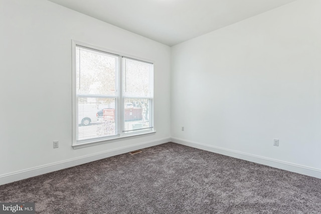2540 Merganser Ct, Waldorf, MD 20601 - spare room with baseboards and dark carpet