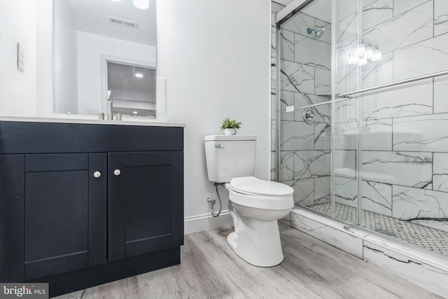 2540 Merganser Ct, Waldorf, MD 20601 - full bathroom featuring vanity, a marble finish shower, toilet, visible vents, and wood finished floors