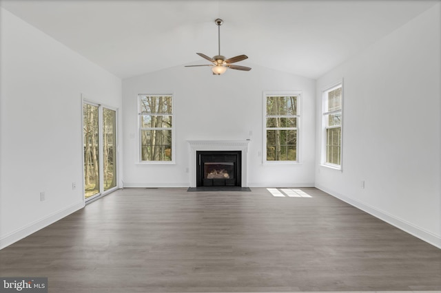 2540 Merganser Ct, Waldorf, MD 20601 - unfurnished living room featuring a fireplace with flush hearth, baseboards, ceiling fan, wood finished floors, and vaulted ceiling