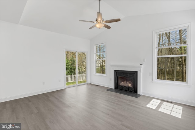2540 Merganser Ct, Waldorf, MD 20601 - unfurnished living room featuring a fireplace with flush hearth, lofted ceiling, ceiling fan, and wood finished floors