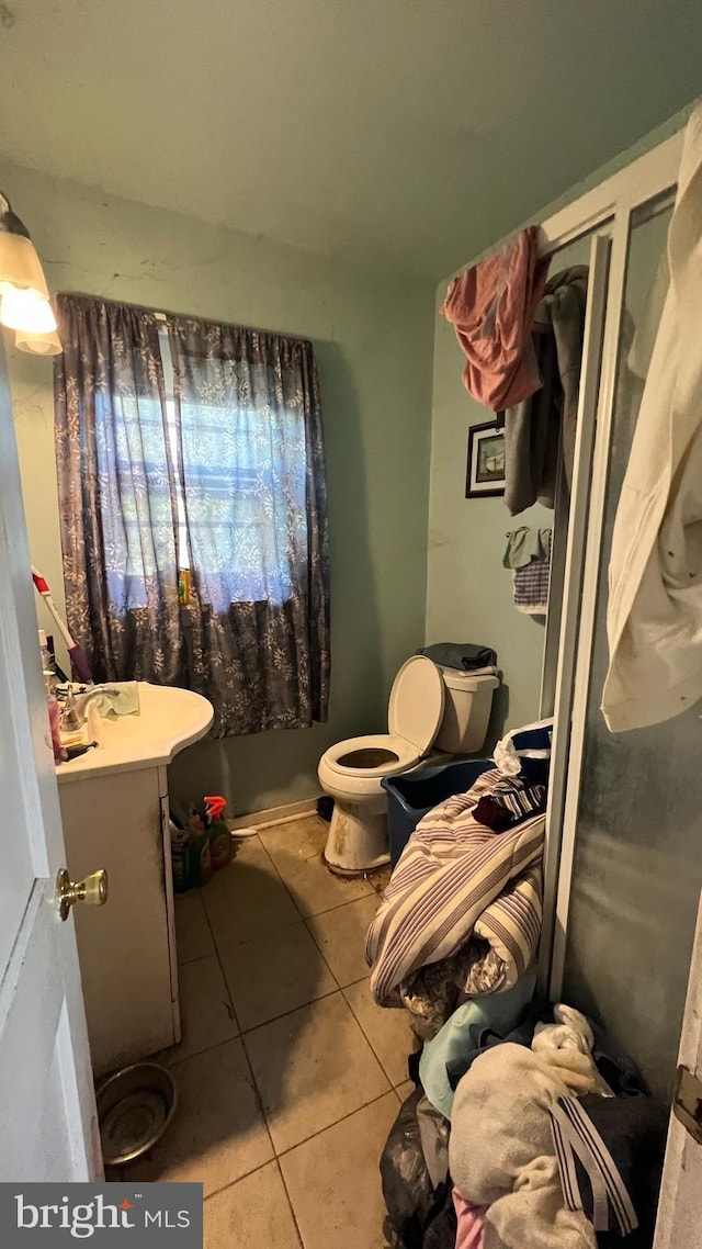 bathroom featuring tile patterned flooring and vanity